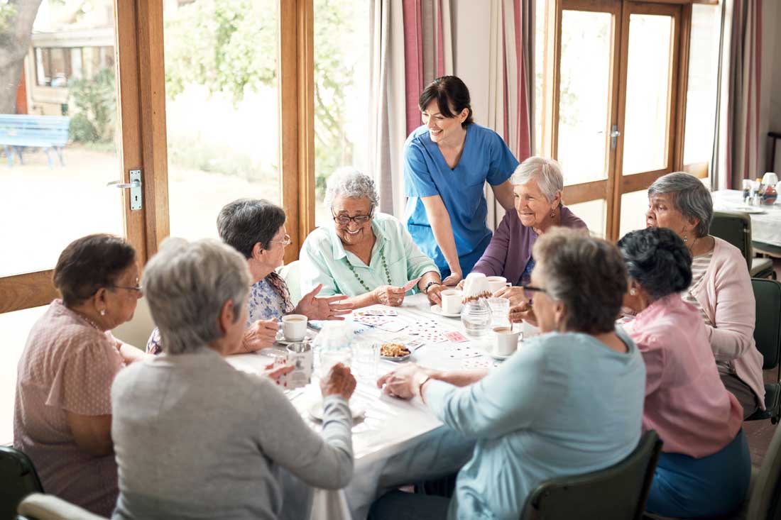 nurse-and-residents-around-table